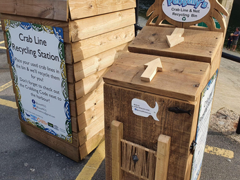 The first two handmade prototype crab line recycling stations made from recycled materials in Looe