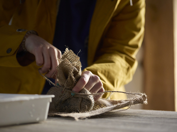 Placing seagrass seed mixtures into biodegradable hessian bags, Image by Seasalt Cornwall as part of the Seeding Change Together project with Cornwall Wildlife Trust