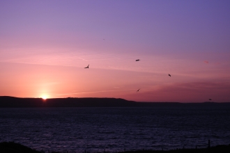 May Sunrise from island by Claire Lewis