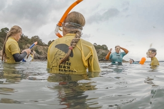 Young people in the water with YSBR Youth Engagement Officer Jenn Sandiford