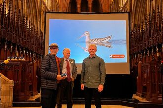 Mark James collects his award from South West Optics, for his feathered friends image which is shown in the background. 