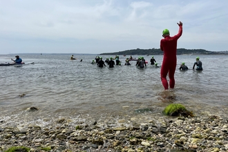 swimmers prepare for the start of the 3k along the bay challenge