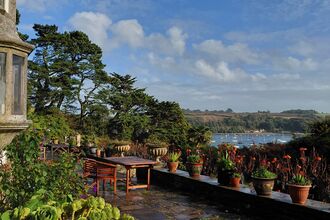 A view from the patio at Pedn Billy overlooking the garden and river