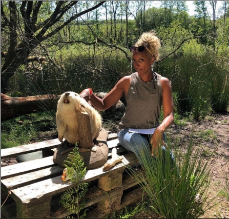 Gillian Burke poses next to Trevor the Beaver (stuffed) at Woodland Valley Farm
