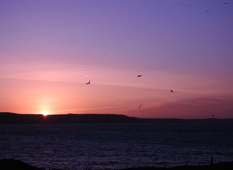 May Sunrise from island by Claire Lewis